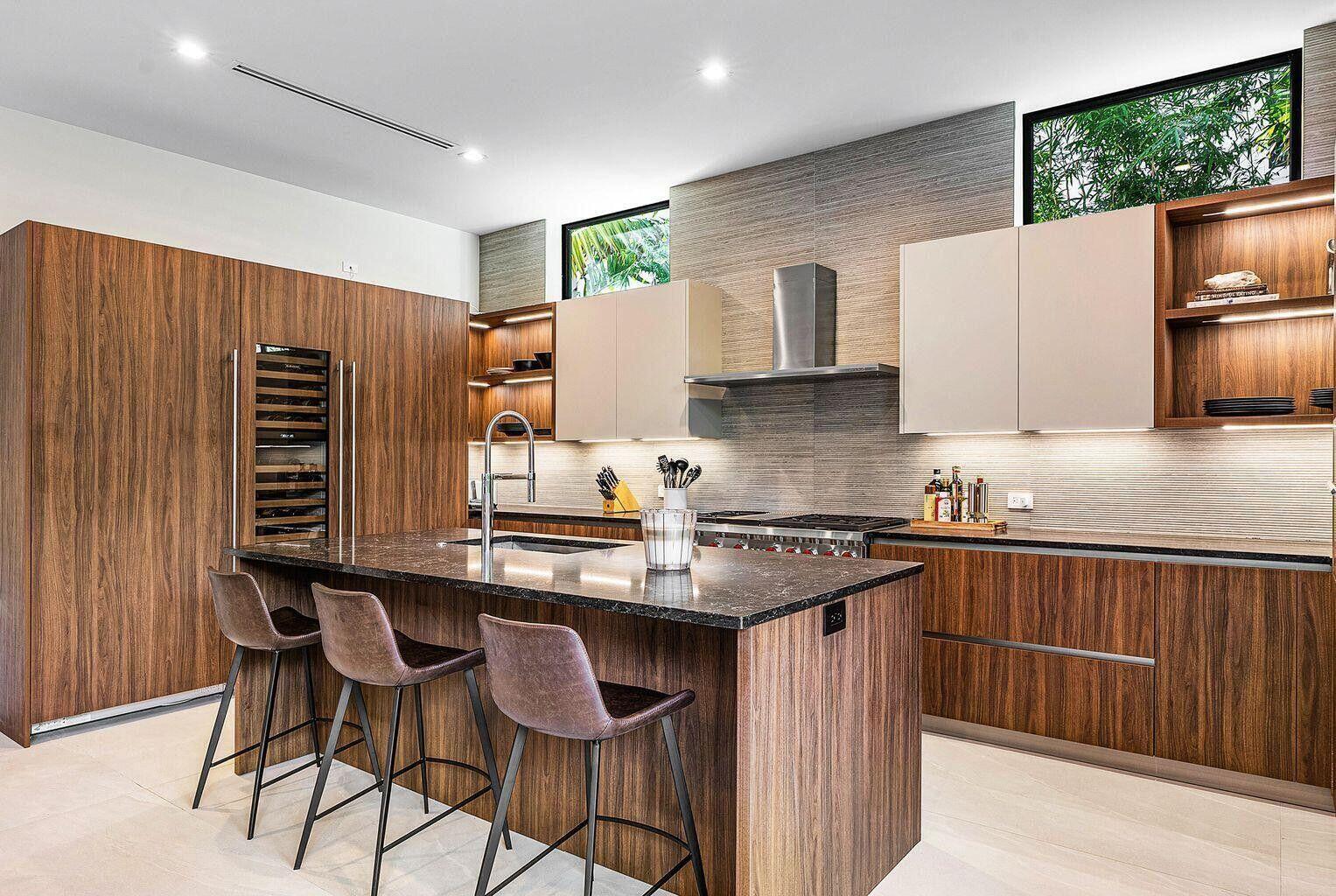 775 Park Drive West Boca Raton, FL 33432 - Photo 16 of 31 a kitchen with stainless steel appliances granite countertop a stove a sink dishwasher and a refrigerator with wooden cabinets