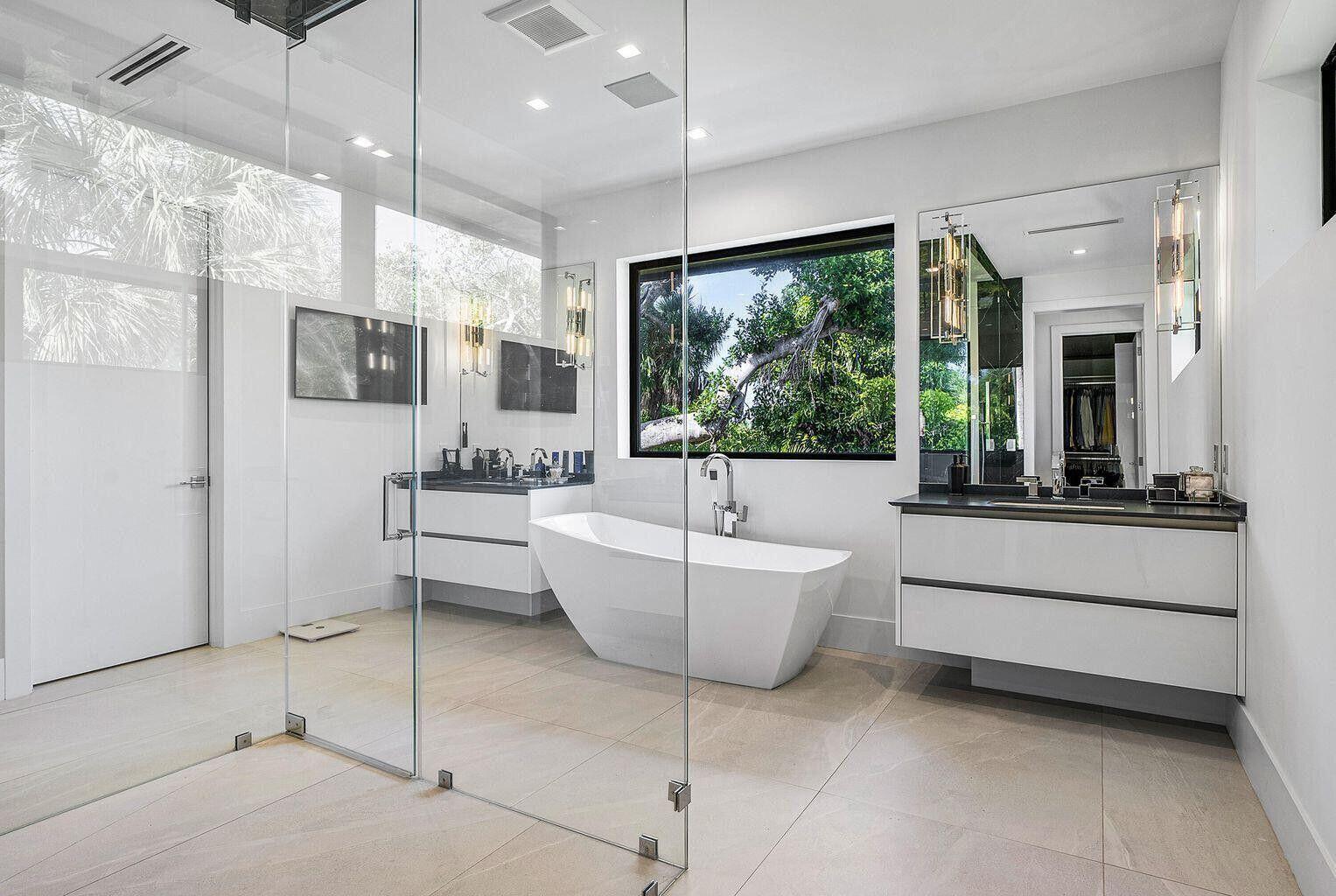 775 Park Drive West Boca Raton, FL 33432 - Photo 28 of 31 a bathroom with a large tub a window and a shower