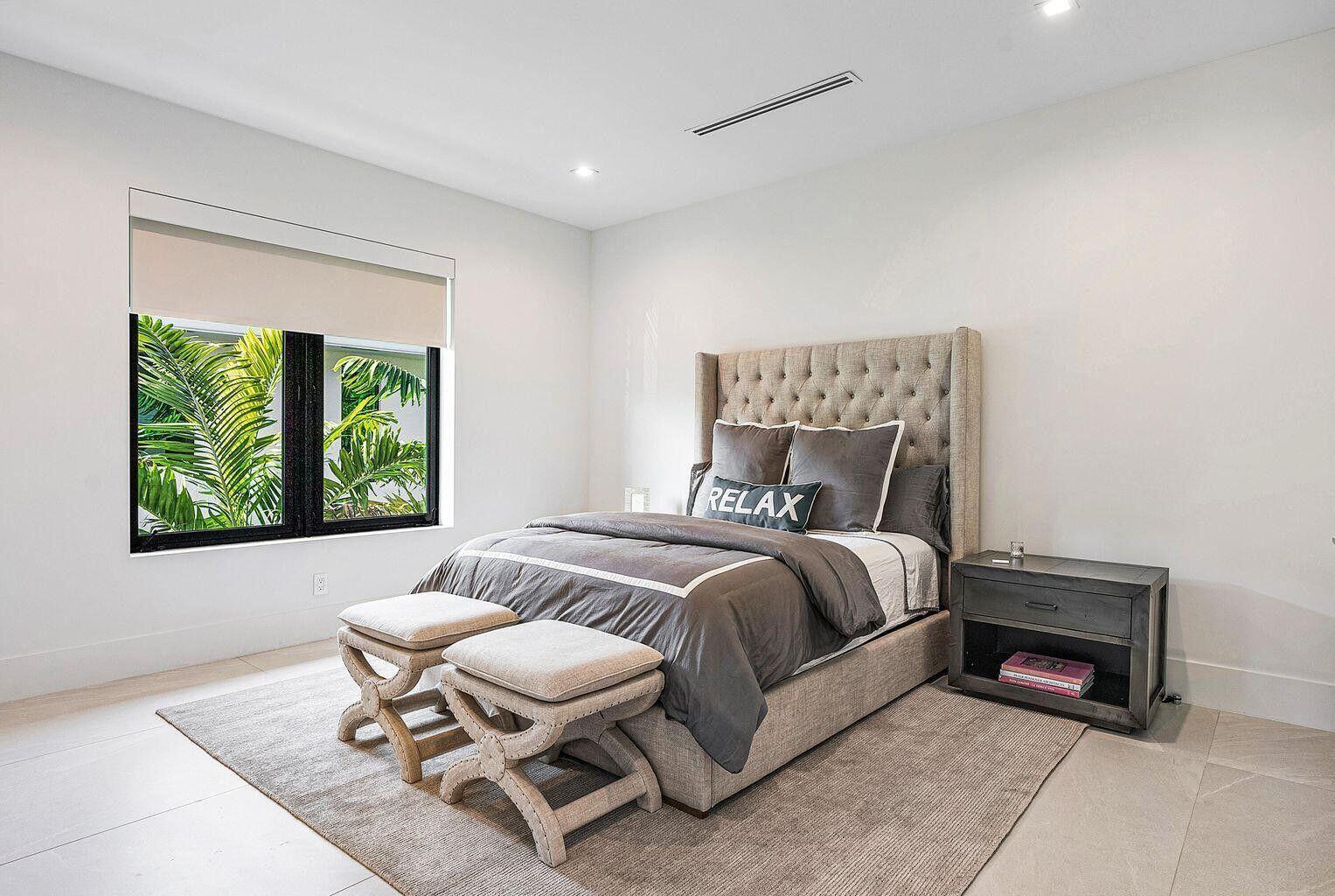 775 Park Drive West Boca Raton, FL 33432 - Photo 31 of 31 a bedroom with a bed and a couch