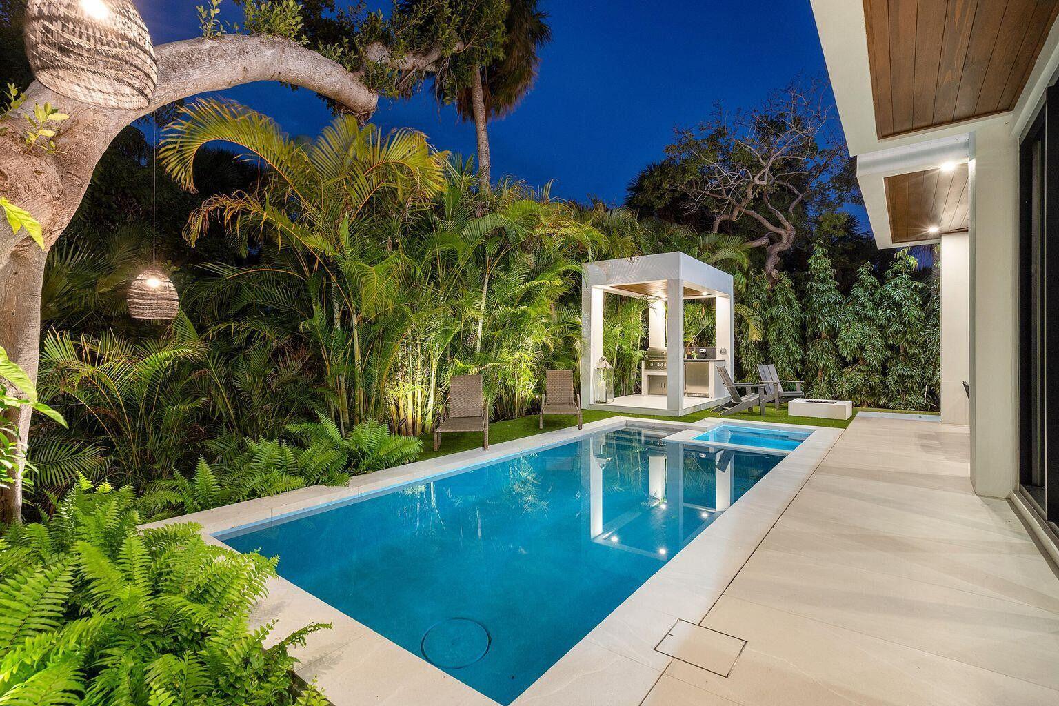 775 Park Drive West Boca Raton, FL 33432 - Photo 4 of 31 a view of a swimming pool with a yard