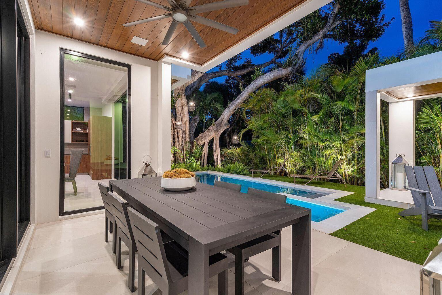 775 Park Drive West Boca Raton, FL 33432 - Photo 10 of 31 a view of an outside dining space with a table and chairs
