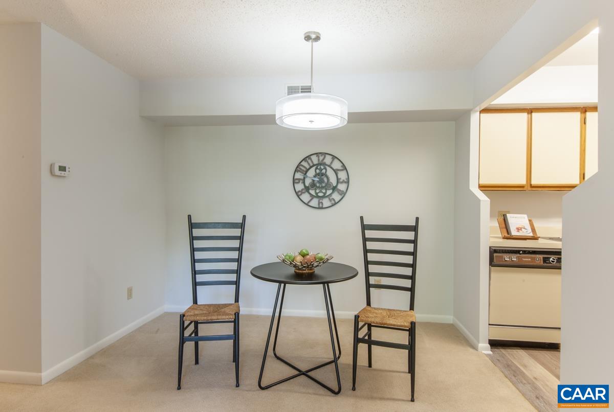 117 Turtle Creek Road, Unit 9 Charlottesville, VA 22901 - Photo 9 of 33 a view of a room with a table and chairs