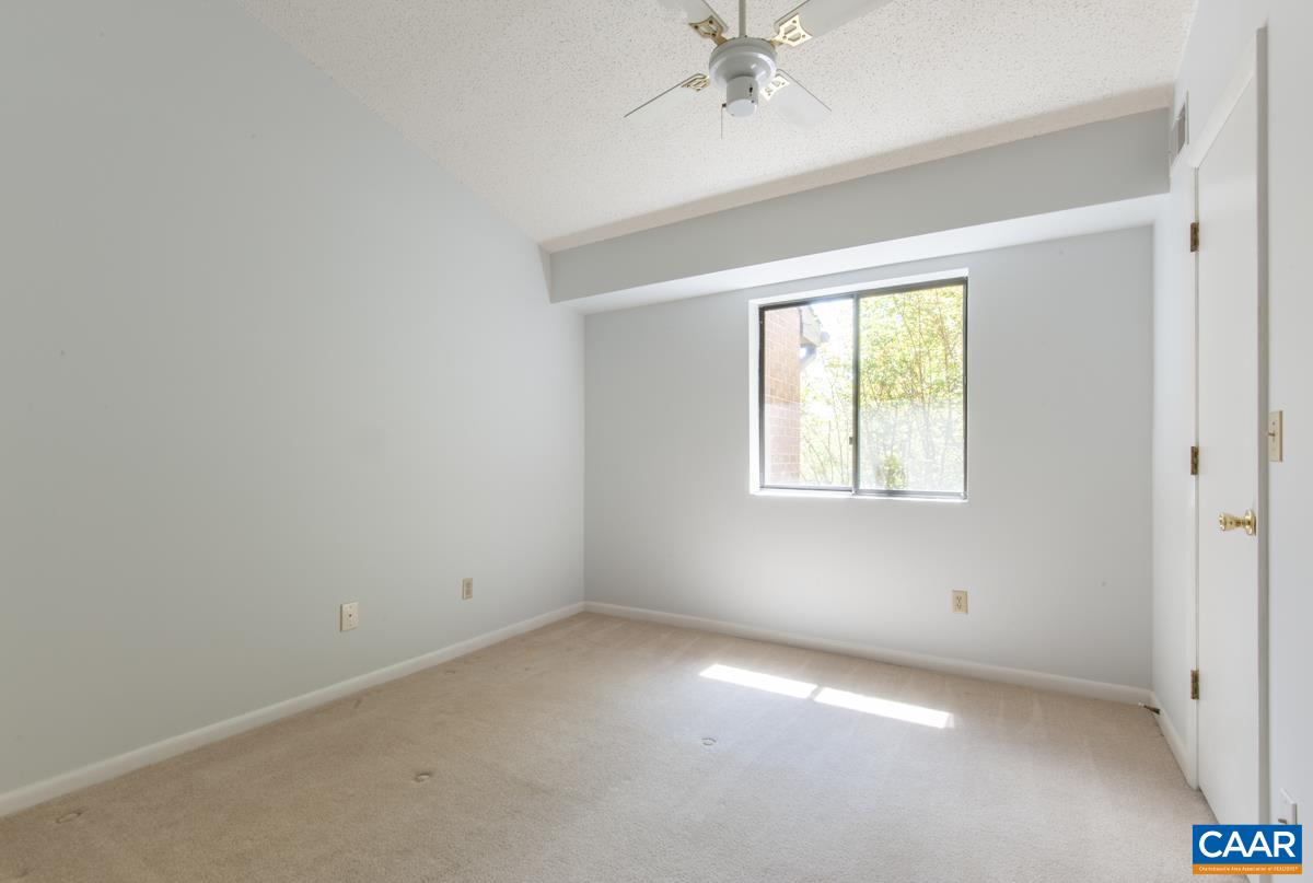 117 Turtle Creek Road, Unit 9 Charlottesville, VA 22901 - Photo 18 of 33 an empty room with a window