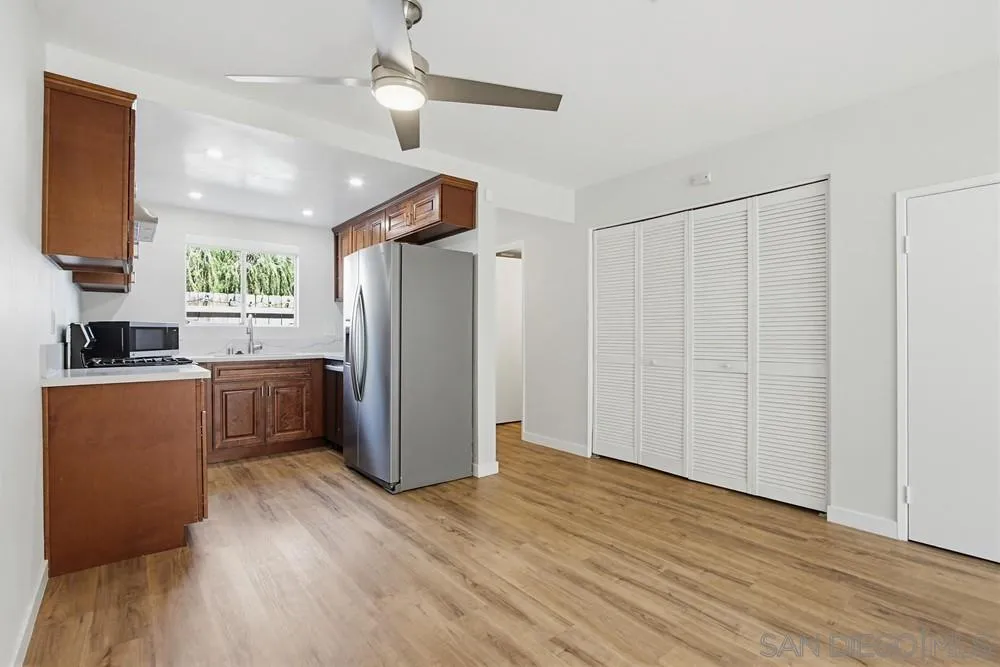 5130 North River Road, Unit B Oceanside, CA 92057 - Photo 17 of 51 a kitchen with stainless steel appliances a refrigerator and a stove top oven