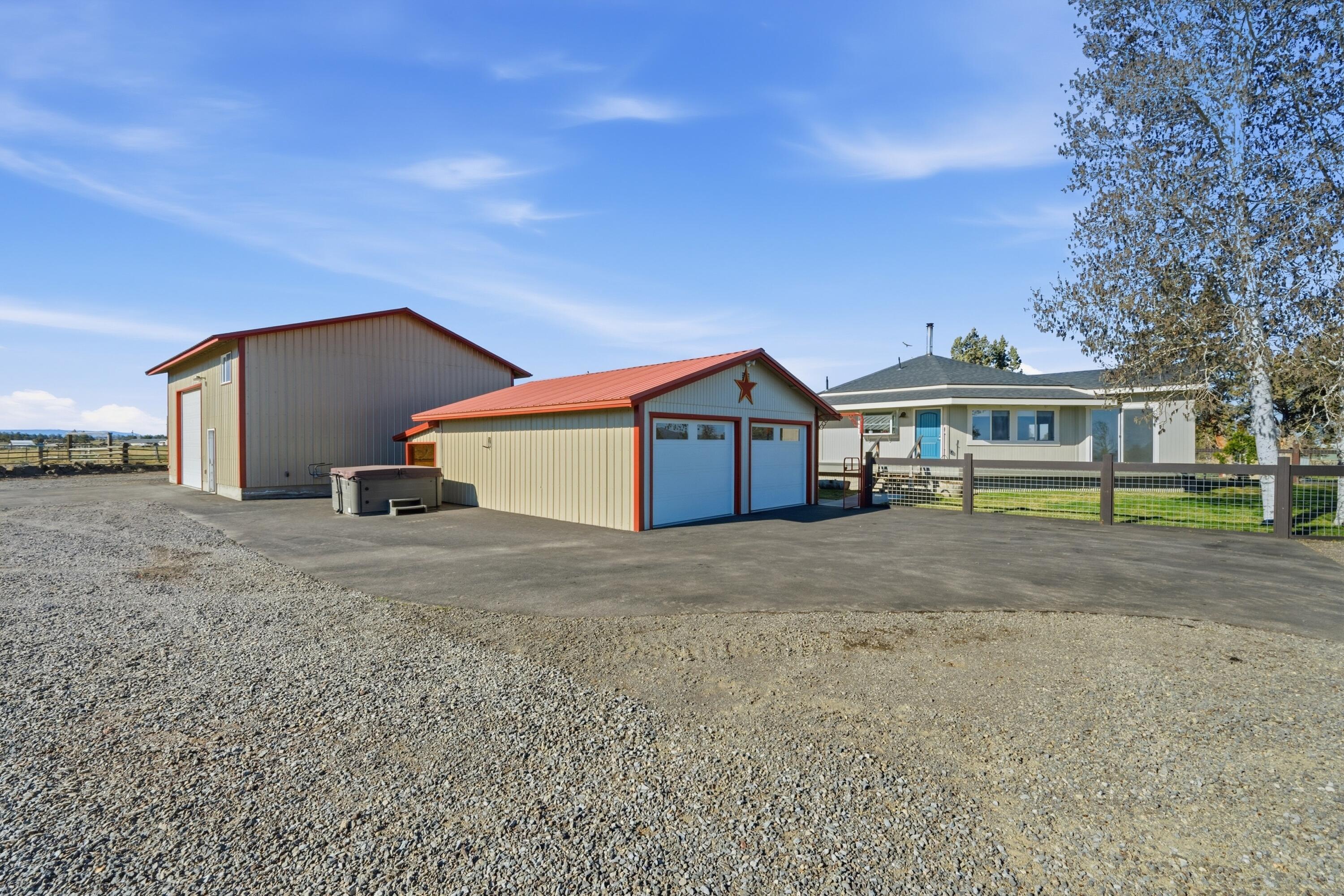 4074 Southwest Reif Road Powell Butte, OR 97753 - Photo 46 of 59 a front view of house with a yard