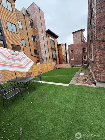 a bedroom with a large bed and a large window with outer view