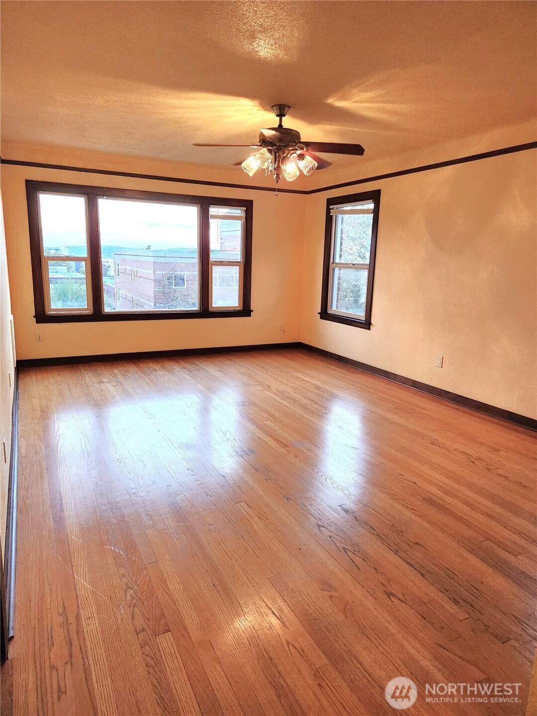16 Valley Street Seattle, WA 98109 - Photo 34 of 40 wooden floor in an empty room with a window