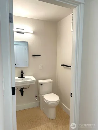 an empty room with wooden floor and a window