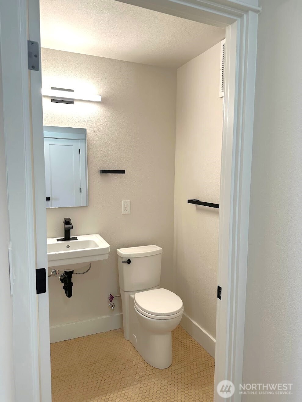 16 Valley Street Seattle, WA 98109 - Photo 37 of 40 a bathroom with a sink toilet and mirror