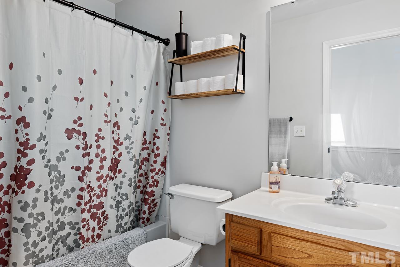 5201 Sutter Way Raleigh, NC 27613 - Photo 23 of 29 This bathroom serves the upstairs bedrooms.