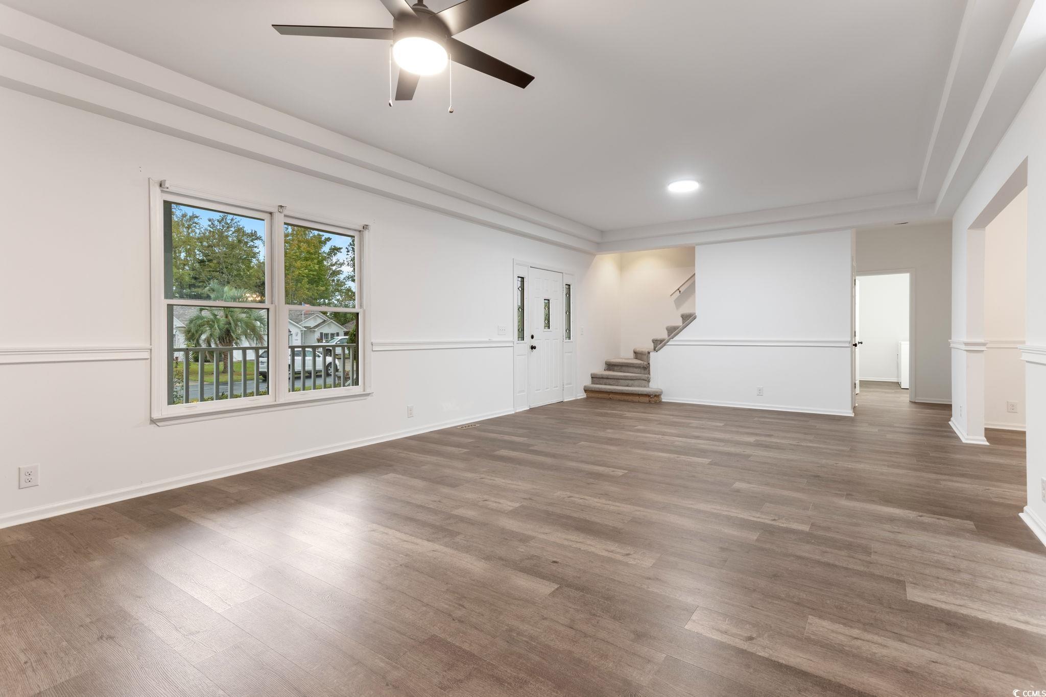 2321 Brick Drive Longs, SC 29568 - Photo 8 of 40 Unfurnished living room featuring wood finished floors, a ceiling fan, stairway, and recessed lighting