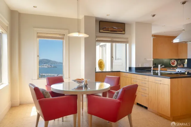 a dining room with furniture and window