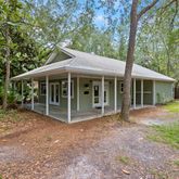 a view of house with a garden