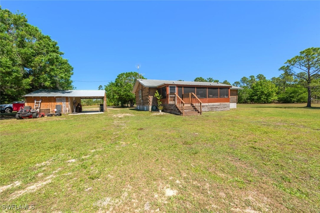 47350 Bermont Road Punta Gorda, FL 33982 - Photo 21 of 41 a front view of a house with yard