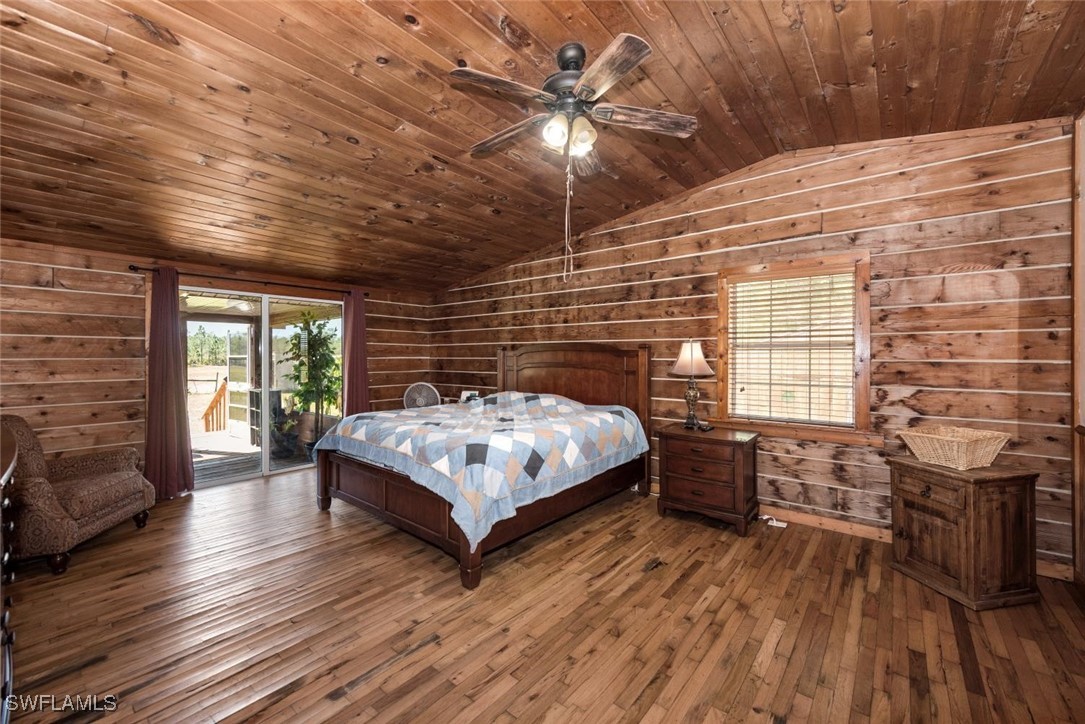 47350 Bermont Road Punta Gorda, FL 33982 - Photo 24 of 41 a bedroom with a bed and wooden floor