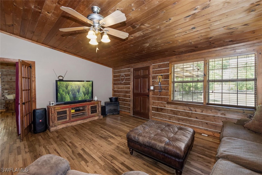 47350 Bermont Road Punta Gorda, FL 33982 - Photo 27 of 41 a living room with furniture and a flat screen tv