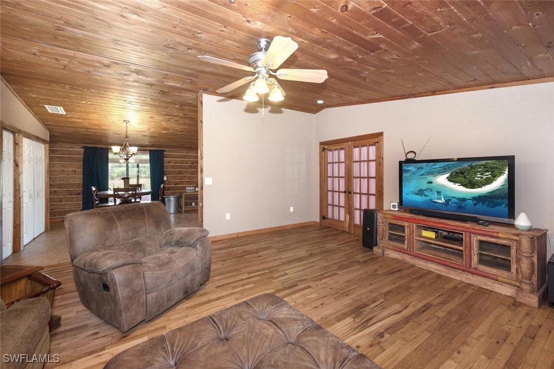 47350 Bermont Road Punta Gorda, FL 33982 - Photo 29 of 41 a living room with furniture and a flat screen tv