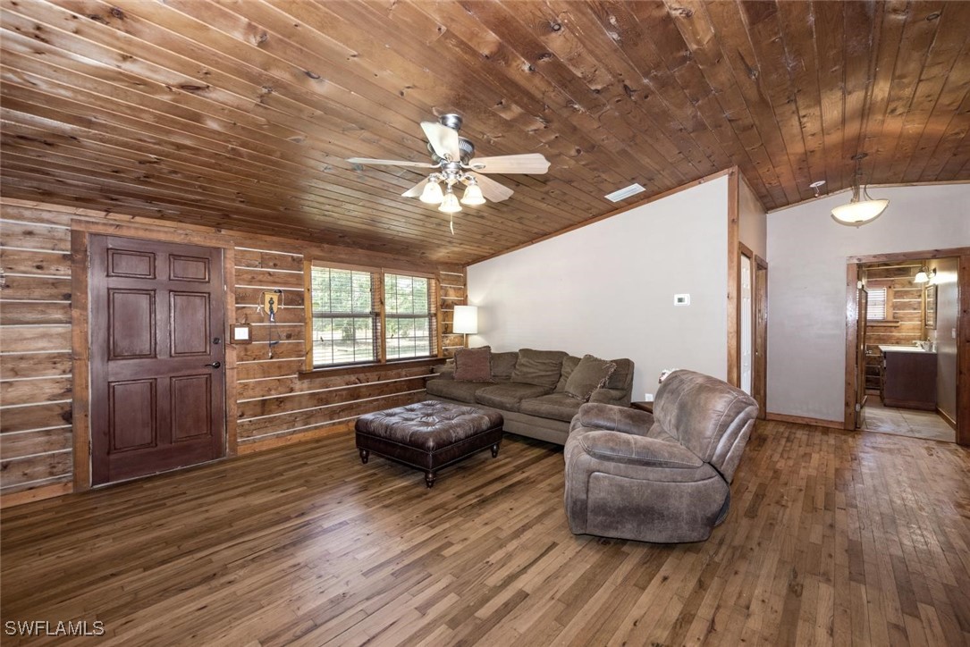 47350 Bermont Road Punta Gorda, FL 33982 - Photo 30 of 41 a living room with furniture and wooden floor