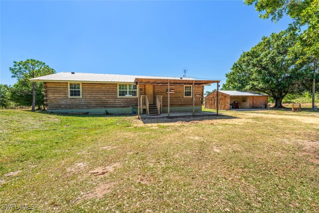 47350 Bermont Road Punta Gorda, FL 33982 - Photo 34 of 41 a front view of a house with a yard