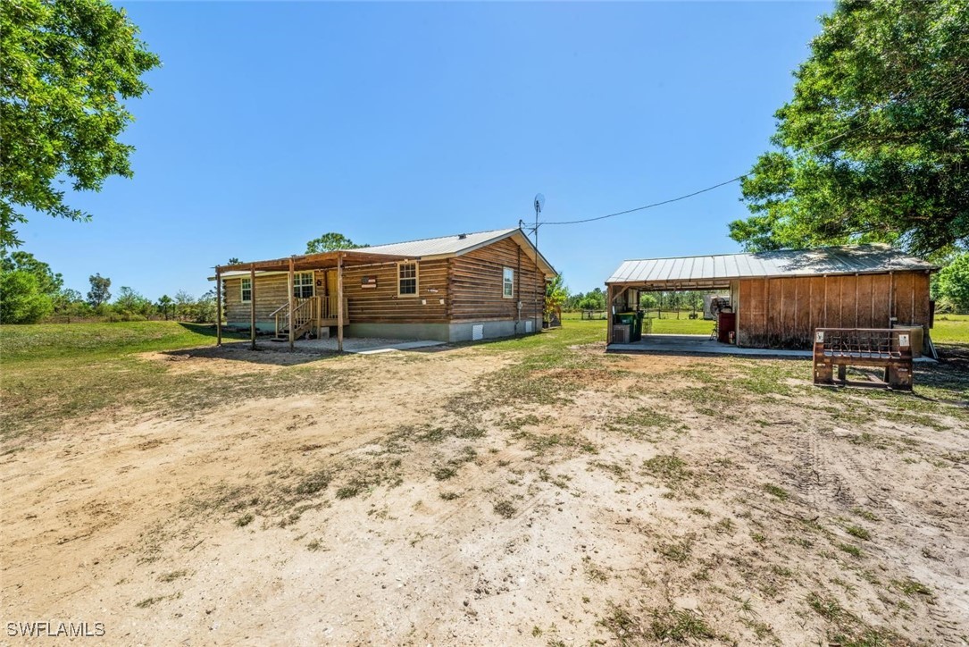 47350 Bermont Road Punta Gorda, FL 33982 - Photo 36 of 41 a view of a house with a yard