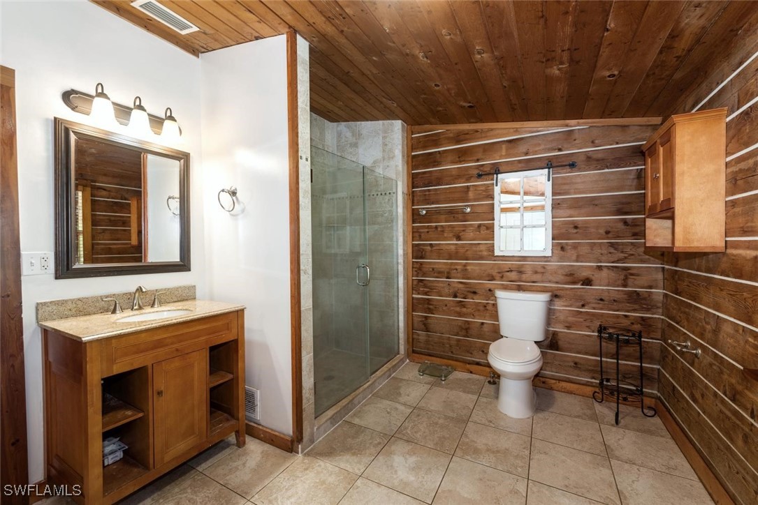 47350 Bermont Road Punta Gorda, FL 33982 - Photo 10 of 41 a bathroom with a toilet sink and mirror
