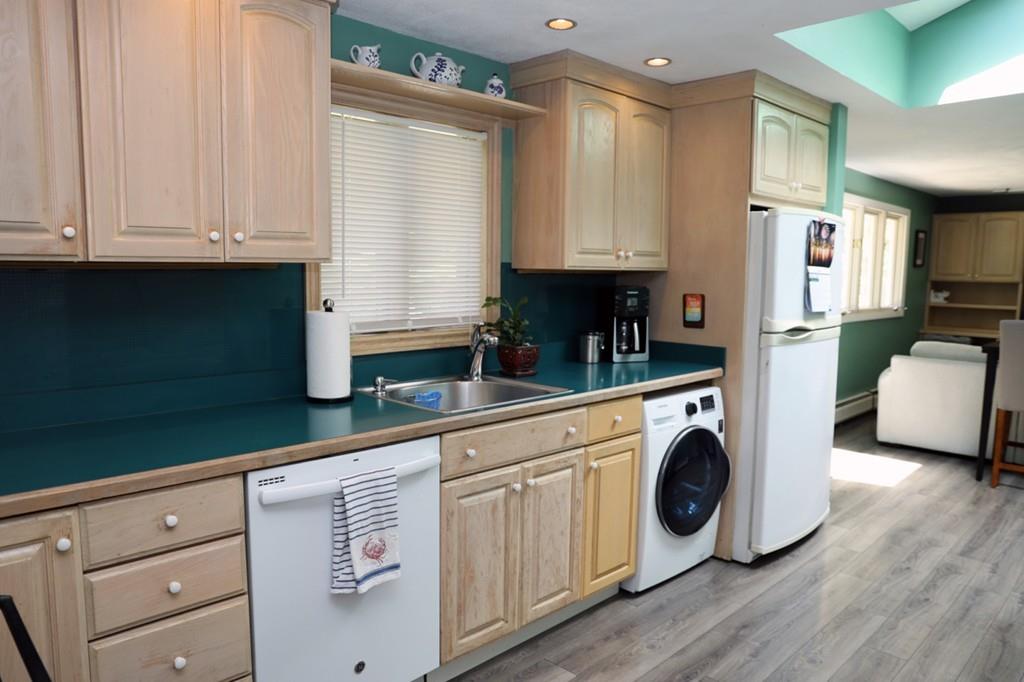 14 Catherine Road Framingham, MA 01701 - Photo 13 of 24 a kitchen with a refrigerator sink and cabinets