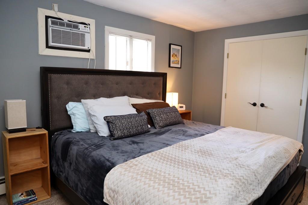 14 Catherine Road Framingham, MA 01701 - Photo 16 of 24 a bedroom with a bed and wooden floor