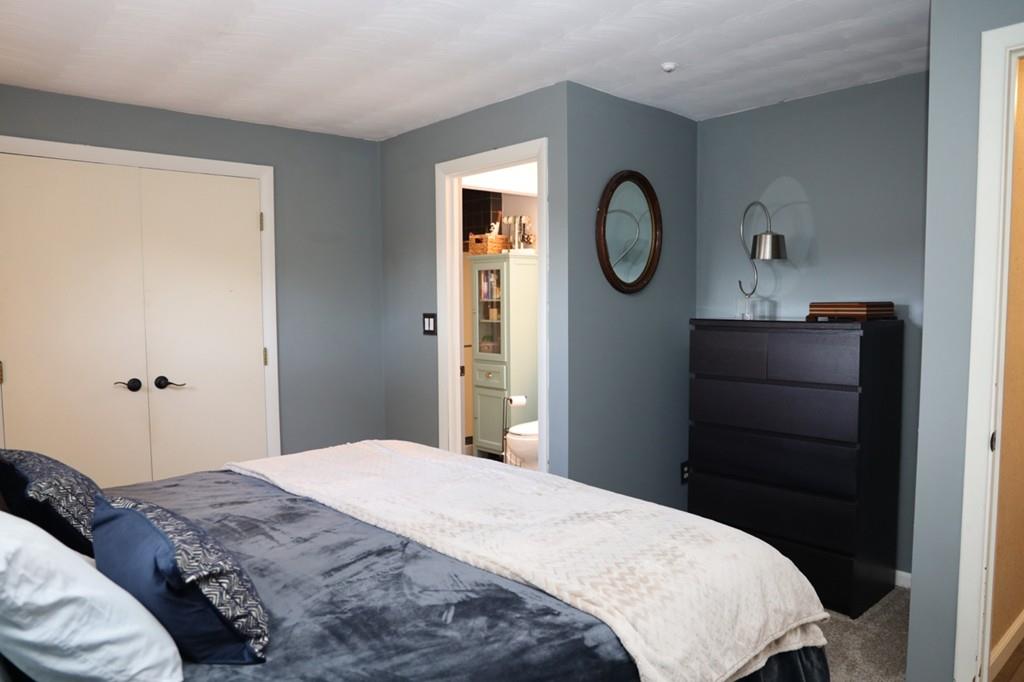 14 Catherine Road Framingham, MA 01701 - Photo 17 of 24 a bedroom with a bed and a mirror