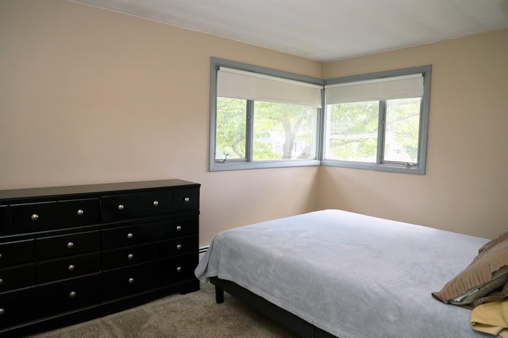 14 Catherine Road Framingham, MA 01701 - Photo 18 of 24 a bedroom with a bed and a window