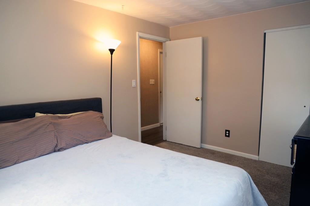 14 Catherine Road Framingham, MA 01701 - Photo 19 of 24 a bedroom with a large bed and a closet