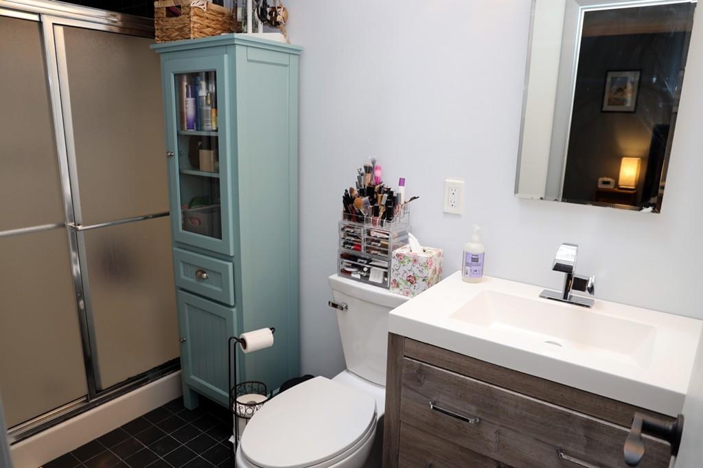 14 Catherine Road Framingham, MA 01701 - Photo 21 of 24 a bathroom with a sink vanity mirror and toilet