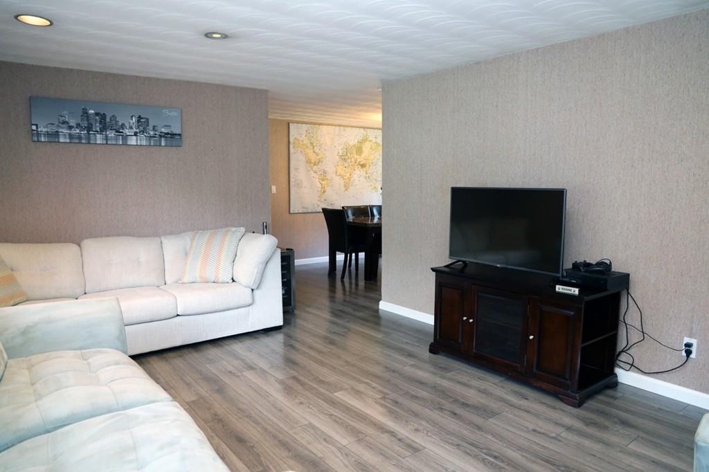 14 Catherine Road Framingham, MA 01701 - Photo 5 of 24 a living room with furniture and a flat screen tv
