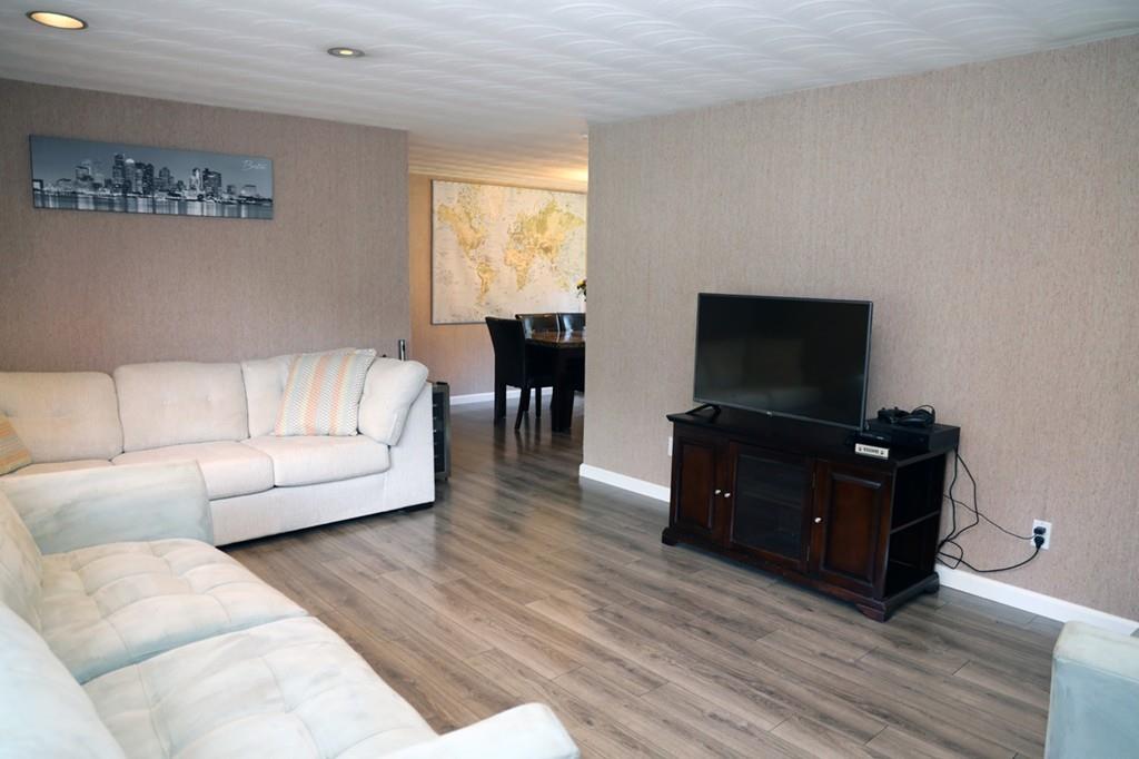 14 Catherine Road Framingham, MA 01701 - Photo 6 of 24 a living room with furniture and a flat screen tv