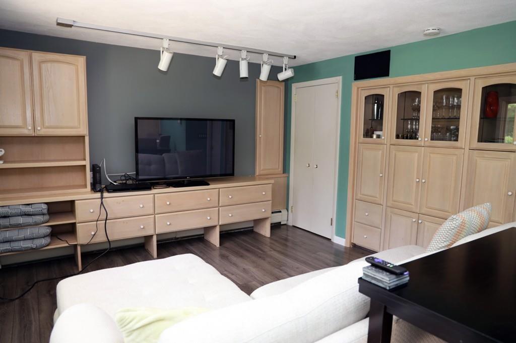 14 Catherine Road Framingham, MA 01701 - Photo 9 of 24 a living room with furniture and a flat screen tv