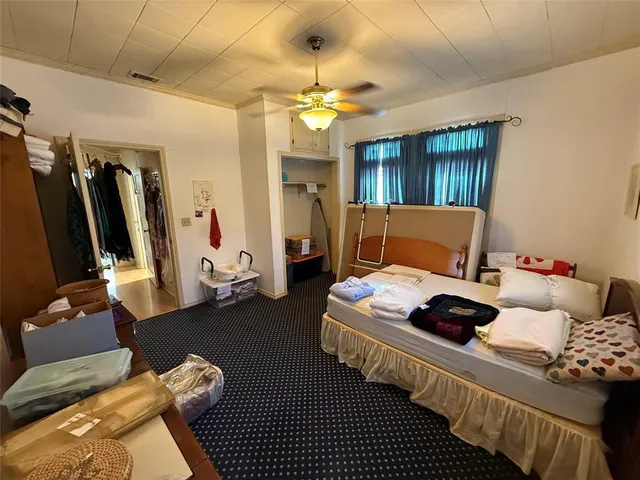 a bedroom with furniture and a chandelier