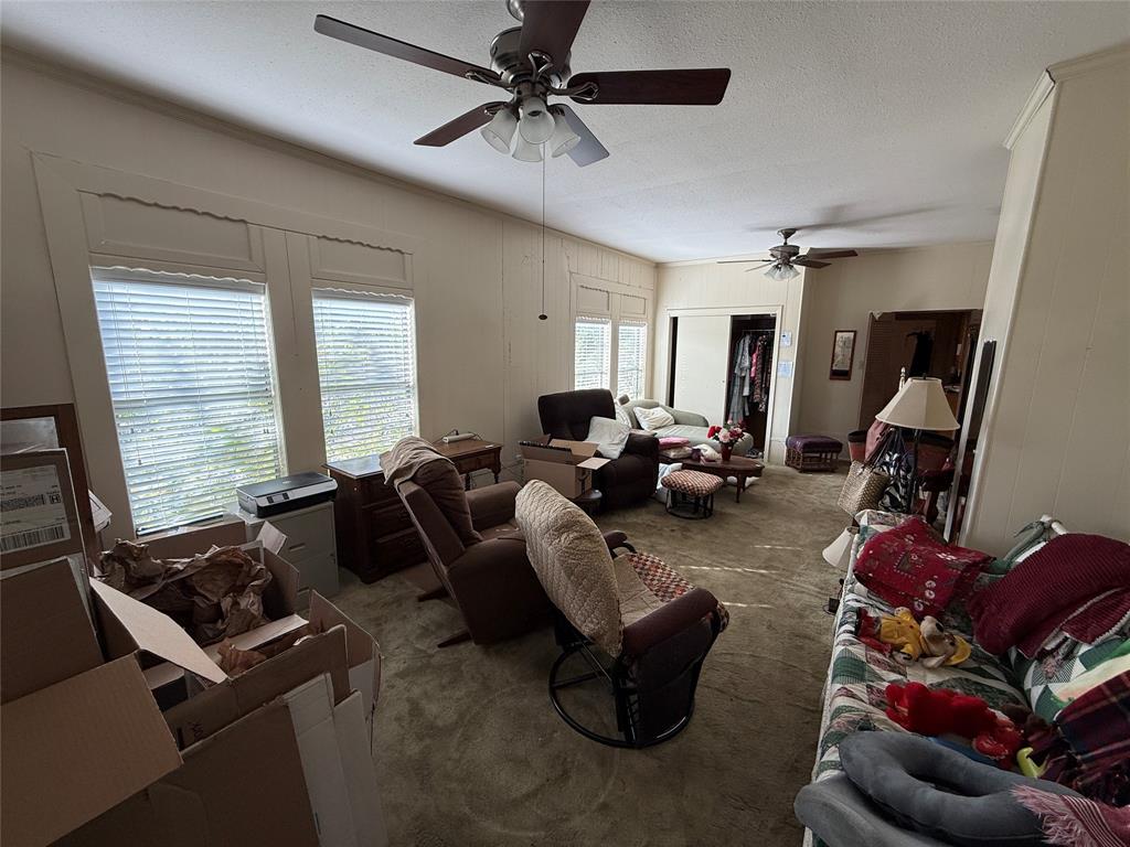 507 South Jackson Street Kaufman, TX 75142 - Photo 10 of 16 a living room with furniture gym equipment and a large window