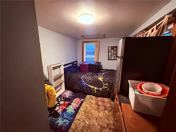a room with furniture a rug and a window