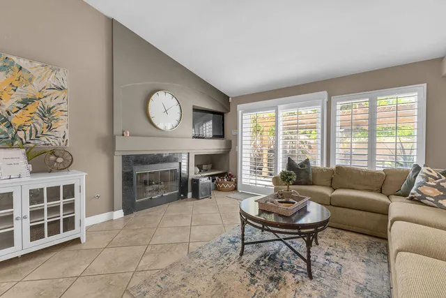 a kitchen with stainless steel appliances granite countertop a refrigerator sink and stove