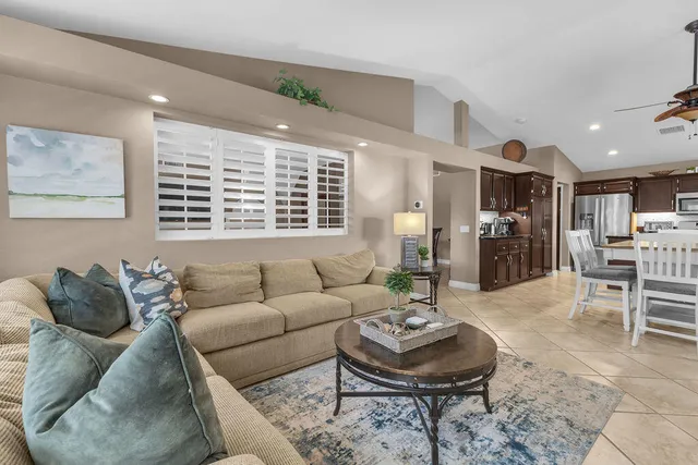 a view of a patio with table and chairs potted plants with wooden floor