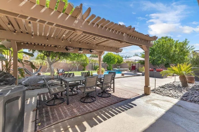 a kitchen with stainless steel appliances granite countertop a stove a refrigerator and a sink