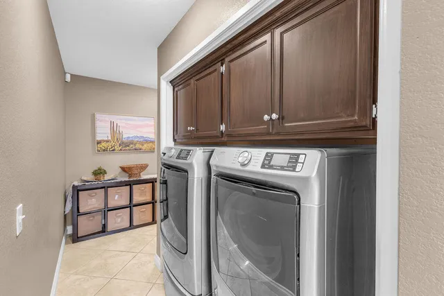 a view of a house with swimming pool and sitting area