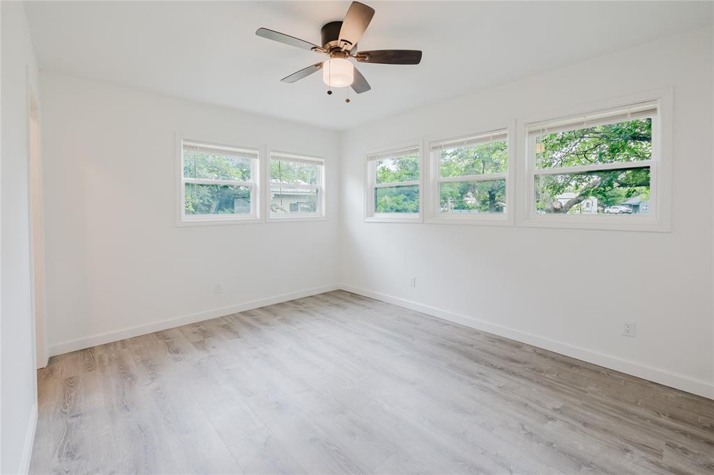 524 West Roberts Street Gorman, TX 76454 - Photo 27 of 35 an empty room with a window and a fan