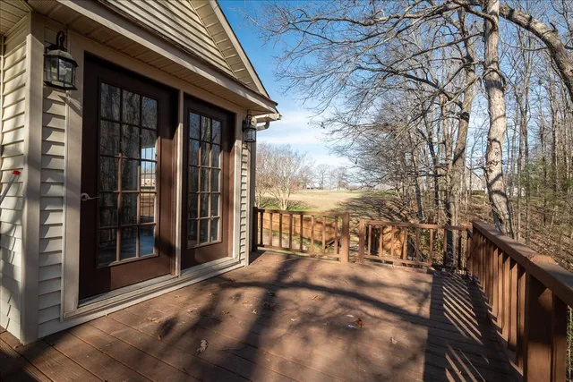 a kitchen with stainless steel appliances granite countertop a refrigerator a stove and a sink