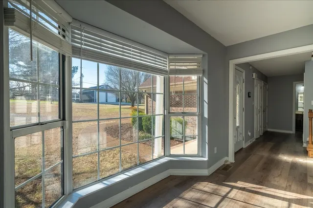 a metallic refrigerator freezer sitting inside of a kitchen