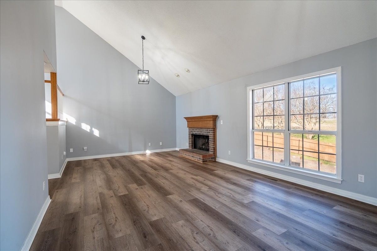 1126 Crowder Road Lawrenceburg, TN 38464 - Photo 19 of 50 a view of an empty room with wooden floor and a window