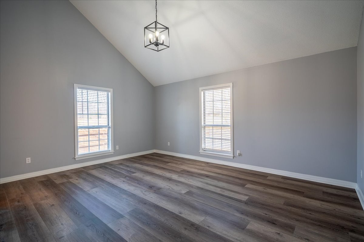 1126 Crowder Road Lawrenceburg, TN 38464 - Photo 26 of 50 a view of an empty room with wooden floor and a window