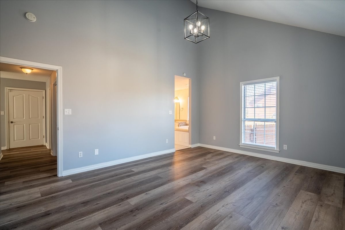 1126 Crowder Road Lawrenceburg, TN 38464 - Photo 27 of 50 an empty room with wooden floor and window