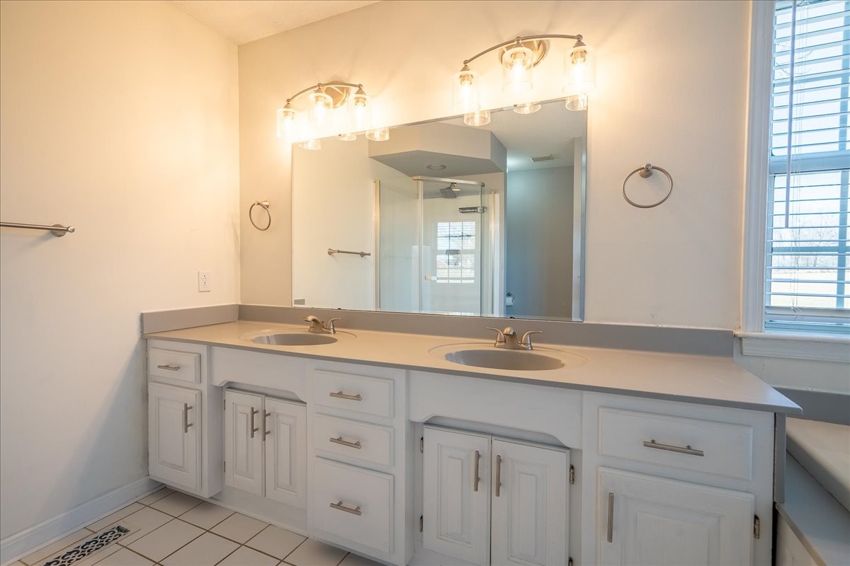 1126 Crowder Road Lawrenceburg, TN 38464 - Photo 31 of 50 a bathroom with a granite countertop sink and a mirror