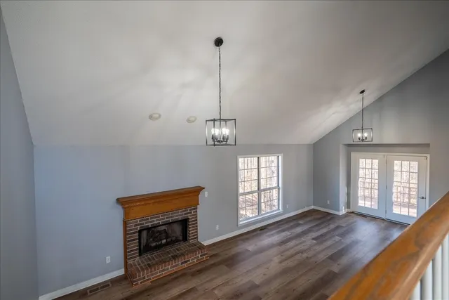 a view of an empty room with a ceiling fan