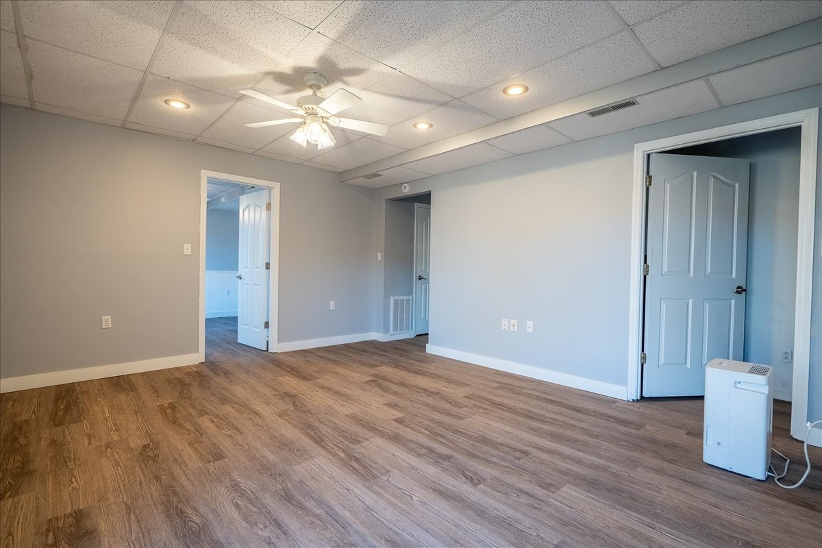 1126 Crowder Road Lawrenceburg, TN 38464 - Photo 45 of 50 an empty room with wooden floor and fan